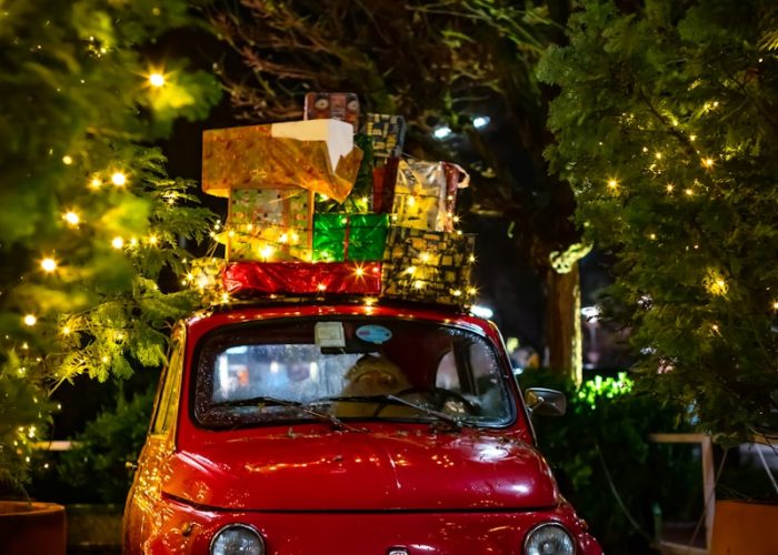 classic red FIAT 500 with christmas boxes on top